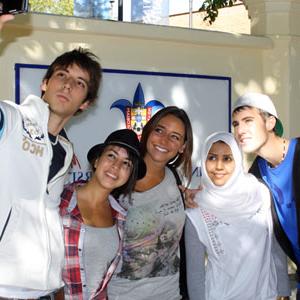 Students stop for a selfie outside of Padre Rubio Hall.